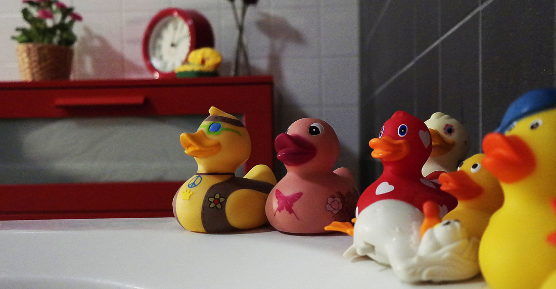 Colorful bath toys arranged in a bathroom setting