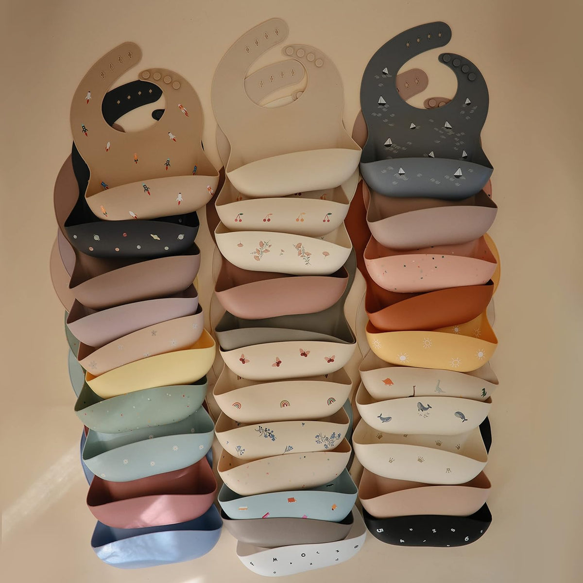 mushie Silicone Baby Bib | Adjustable Fit Waterproof Bibs (Bows)