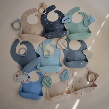 mushie Silicone Baby Bib | Adjustable Fit Waterproof Bibs (White Daisy)