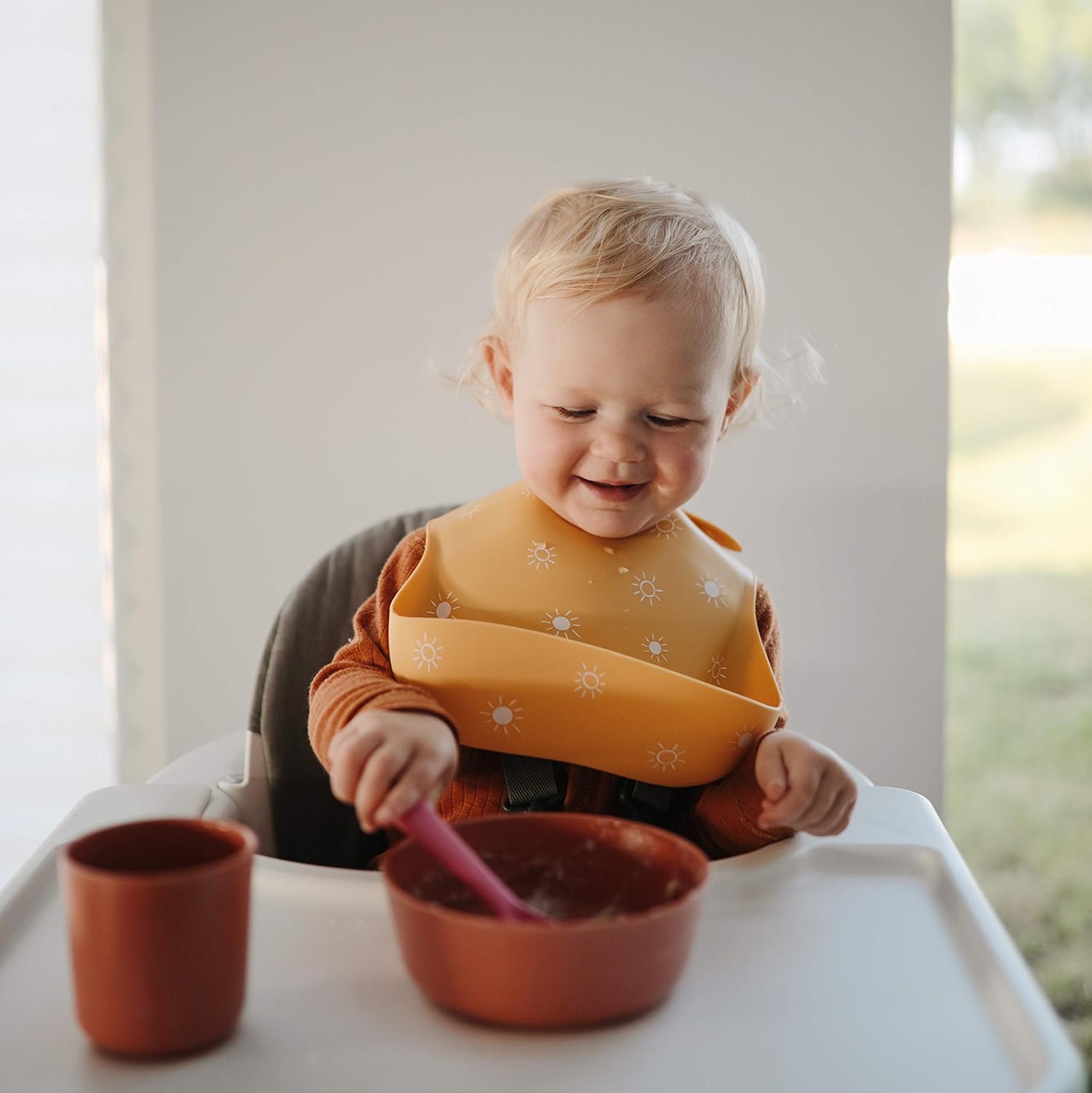 mushie Silicone Baby Bib | Adjustable Fit Waterproof Bibs (Sun Orange)