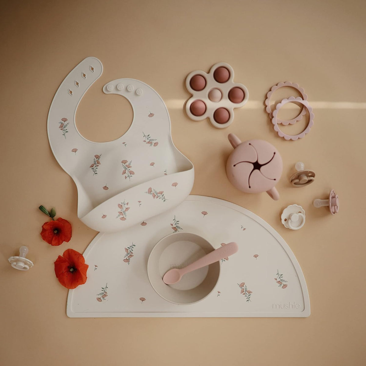 mushie Silicone Baby Bib | Adjustable Fit Waterproof Bibs (Pink Flowers)