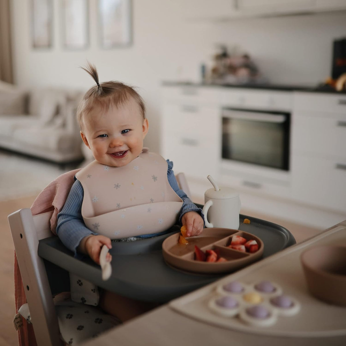 mushie Silicone Baby Bib | Adjustable Fit Waterproof Bibs (Daisy)