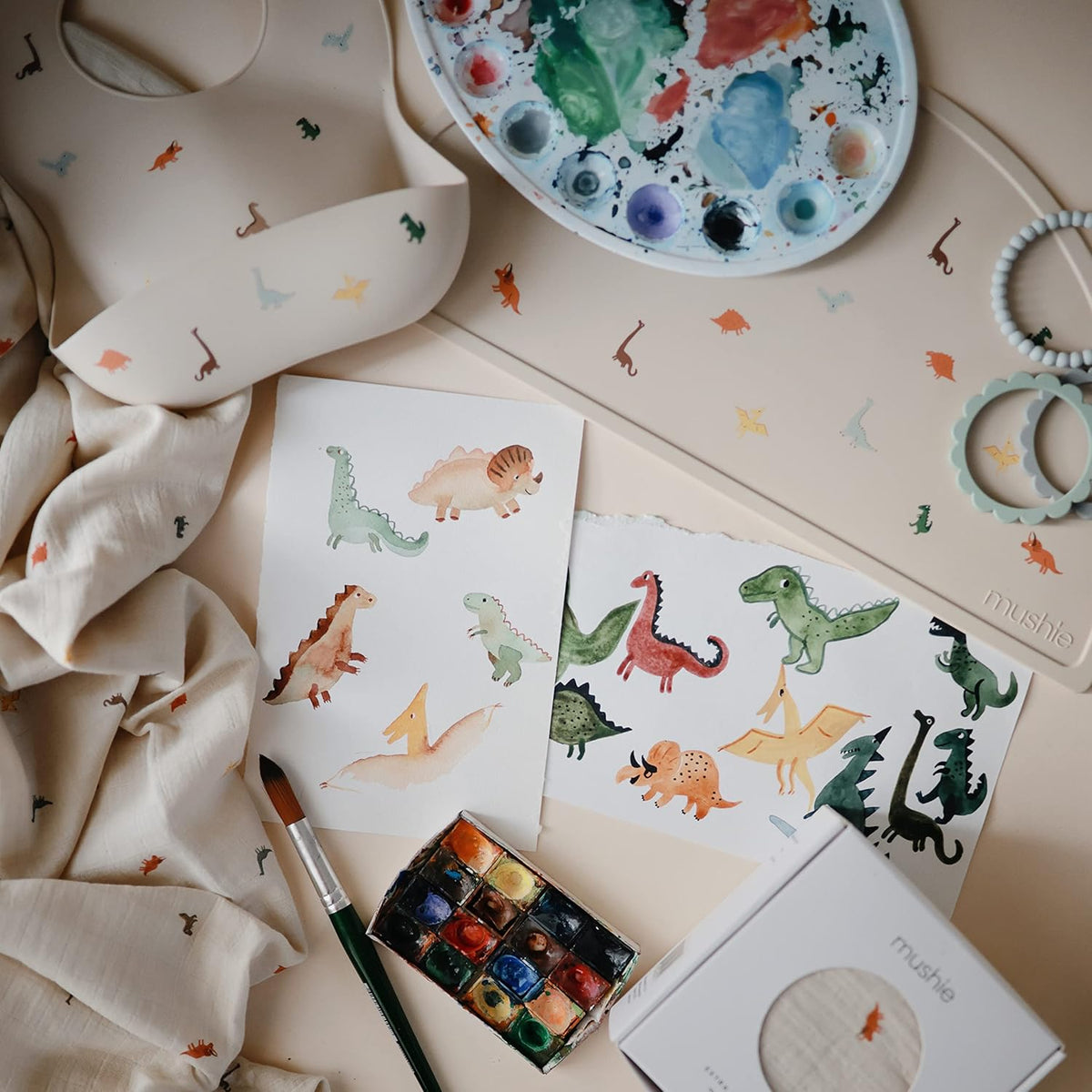mushie Silicone Baby Bib | Adjustable Fit Waterproof Bibs (Dinosaurs)