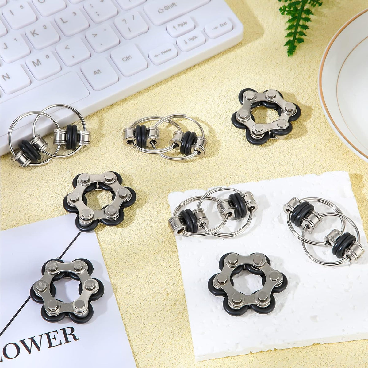 Hicarer 8 Pieces Fidget Toys Set includes 4 Flippy Roller Chain and 4 Six Roller Bike Chain Toys